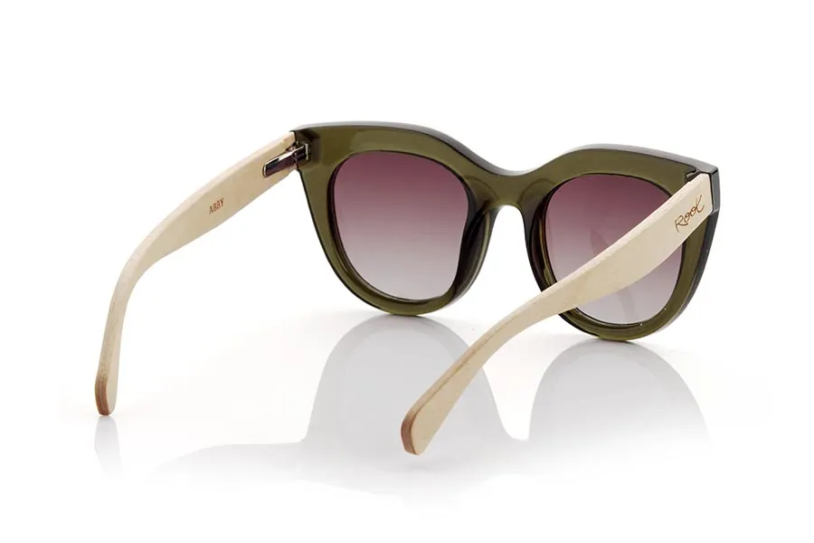 Wood eyewear of Maple ABBY. ABBY sunglasses are the perfect complement to any feminine and modern look. Its front in transparent satin khaki green, with a rounded shape and an angular edge, gives it a unique and elegant touch. Its maple wood temples add a natural and sustainable style to the frame. In addition, the brown gradient lenses provide complete protection against UV rays, without compromising your style. ABBY glasses are ideal to wear on any occasion. Dare to wear a fresh and sophisticated look with them! front Size: 147x59cm Caliber 51 for Wholesale & Retail | Root Sunglasses® 